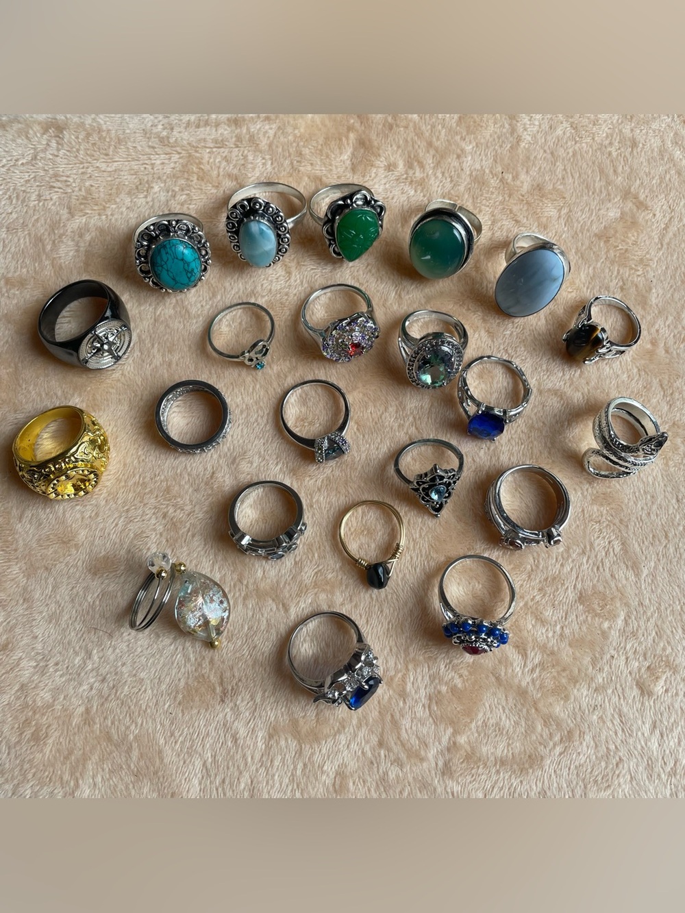 Lot of 22 fashion rings multiple sizes, glass ring holder and heart tin box .